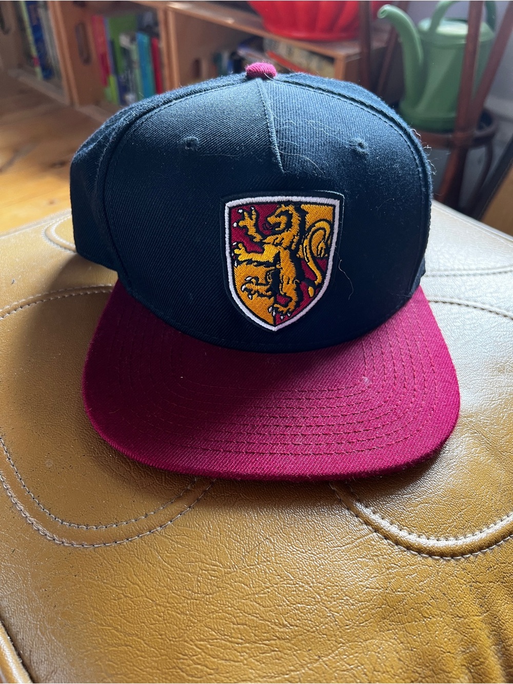 Harry Potter Gryffindor Black and Burgundy Shield Lion Snapback Hat